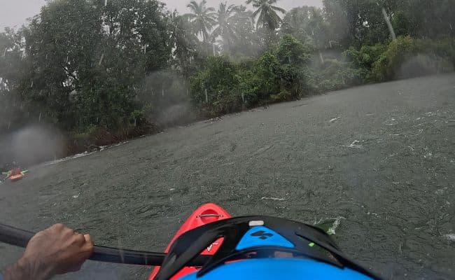 Kayaking down a rapid