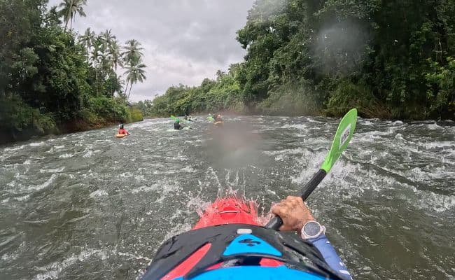 Kayaking down a rapid