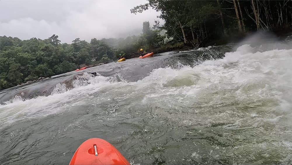 Students running rapids