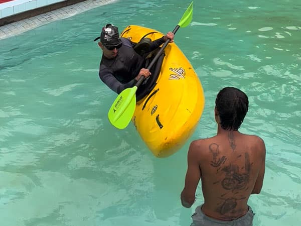 Practicing roll in swimming pool