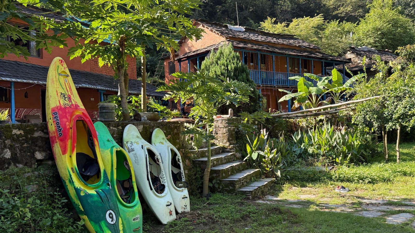 Kayaks arranged in front of the lodge